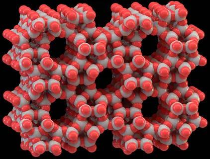 3d molecular model of zeolite mineral granules showing aluminosilicate framework with red and gray atoms