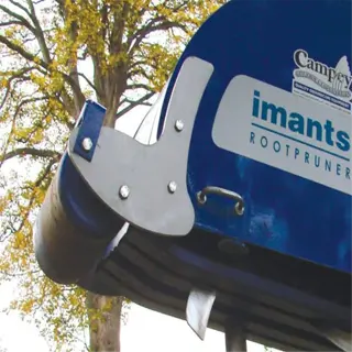 a blue imants root pruner on a grassy field