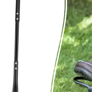 a bulb planter tool being used to dig a hole in the lawn for planting bulbs