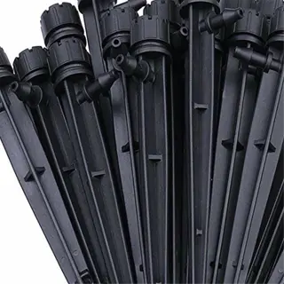 a bunch of black plastic drip emitters for garden irrigation