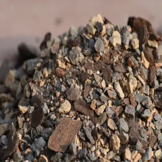 a close-up view of a soil mix component, showing a blend of various sized rocks and organic matter