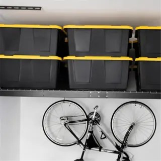 a garage with overhead storage bins and a bike hanger, demonstrating storage longevity