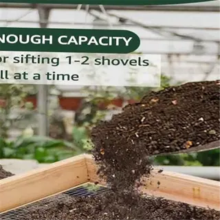 a large wooden compost sieve with a shovelful of soil being sifted
