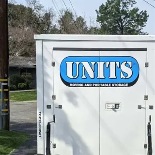 a portable storage unit labeled 'units' parked on a street, indicating a potential long-term storage solution for moving and storage needs