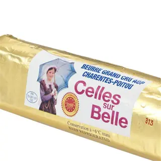 a roll of celles sur belle grand beurre aop butter in gold packaging