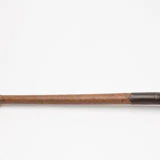 a trenching spade with a wooden handle and metal blade