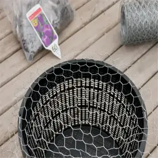 a wire mesh is being attached to a plastic basket to create a bulb basket for gardening