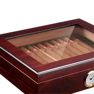 a wooden cigar box with a glass top and a hygrometer
