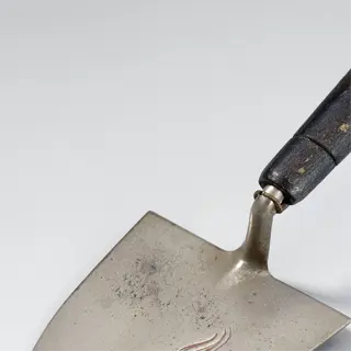 antique stainless steel trowel with wooden handle