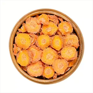 carrot dehydration slices: dried carrot rounds in a wooden bowl, ready for storage