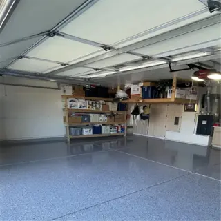clean garage space with epoxy flooring and organized storage