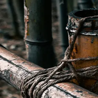 close-up of bamboo grid garden stakes tied with rope