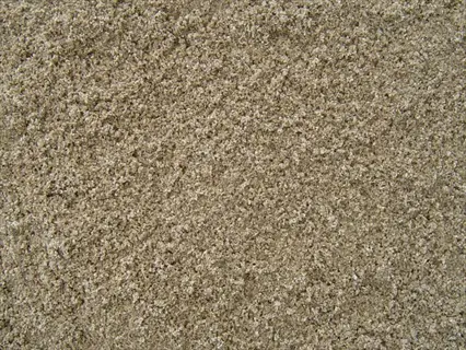 close-up of coarse horticultural sand with light beige granular texture