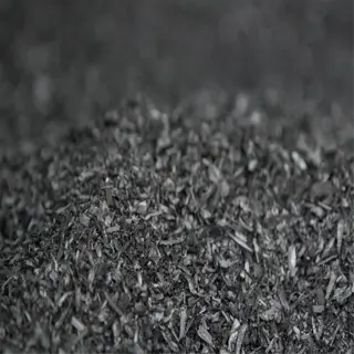 close-up of dark biochar soil amendment