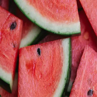 close-up of freshly sliced watermelon wedges with vibrant red flesh