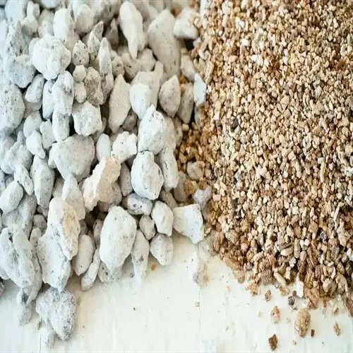 close-up of perlite (white porous rocks) and vermiculite (golden flakes) for soil amendment in perlite vermiculite soil mix