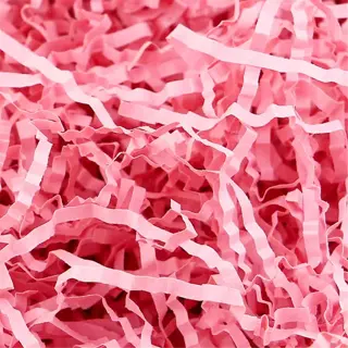 close-up of pink shredded paper filling for packaging