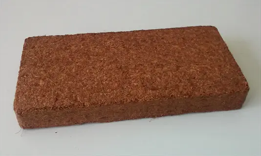 compressed coconut coir bricks: a rectangular block of natural coconut fiber used as an organic soil amendment or growing medium in gardening