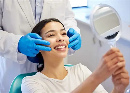dentist performing oral examination on patient at neem dental care clinic