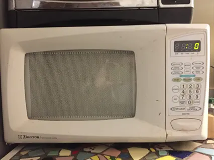 emerson microwave oven (microwave method appliance) for tarragon microwave drying, showing control panel with text labels and digital display