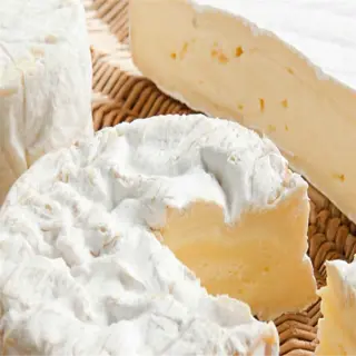 examples of cheese rind textures, including a white, fuzzy rind and a smooth, creamy rind