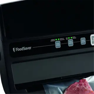 foodsaver v3230 vacuum sealing machine with meat in a sealed bag