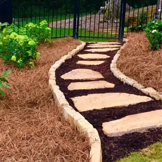 garden path with pine needles mulch and stone steps