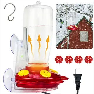 heated hummingbird feeder with red base, yellow flowers, electric heating element, and snowy outdoor backdrop with hummingbird