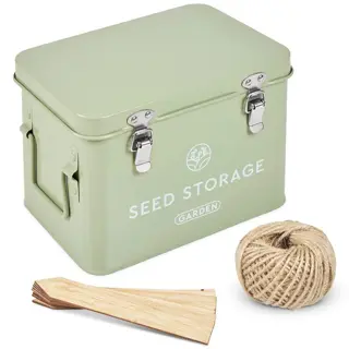 mint-green metal garden seed tin with latches, labeled 'seed storage' and 'garden', shown with twine and plant labels for gardening organization