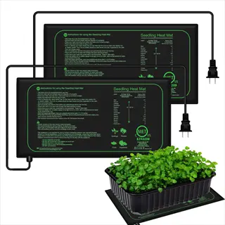 multiple seedling heat mats with printed instructions, power cords, and thriving seedlings in a tray demonstrating germination use