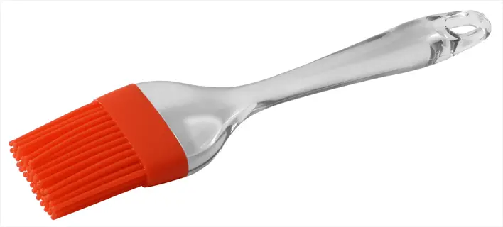 orange silicone vegetable cleaning brush with clear plastic handle, isolated on white background