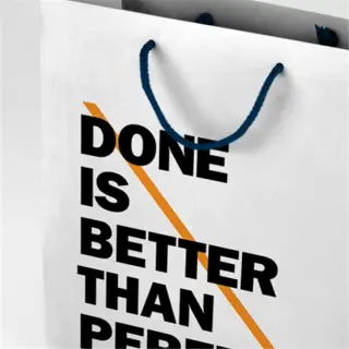 paper bag with the quote 'done is better than perfect' by denny santoso