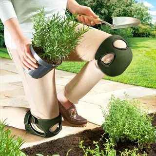 person wearing gardening knee pads while kneeling to plant a potted herb with a trowel in a sunny garden