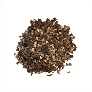 pile of specialty potting soils with mixed textures and colors (brown, beige, dark chunks) for houseplant cultivation