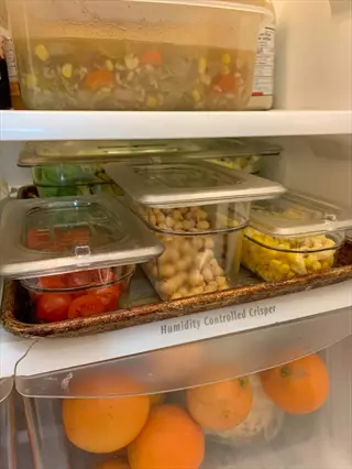 refrigerator interior showing a humidity-controlled crisper drawer for vegetables; demonstrates refrigerator crisper vegetables storage strategy to maintain freshness and crispness