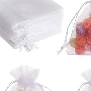 set of white breathable mesh bags filled with colorful pompoms