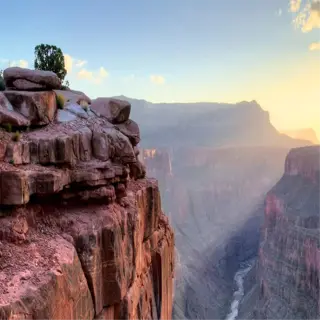 the grand canyon at sunset with sunbeams illuminating the rocky cliffs