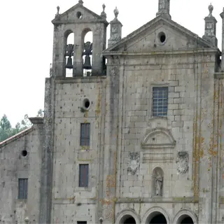 the historic church of padrón, spain, with its distinctive bell towers and stone facade