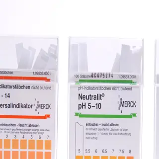 three packs of ph test strips with different ranges and colors