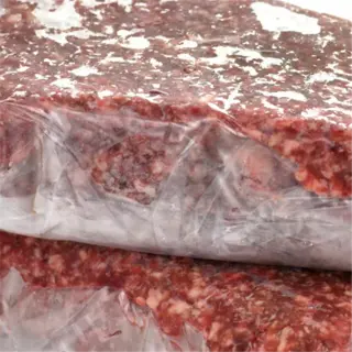 two packages of ground meat, likely beef, showing freezing whole for storage