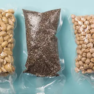 vacuum sealed seed bags containing chia seeds, chickpeas, and cashews - airtight preservation for long-term storage