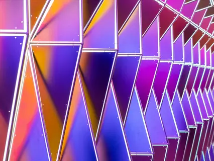 vibrant geometric installation with triangular prismatic glass panels featuring color gradients and illuminated edges in purple, pink, and blue hues