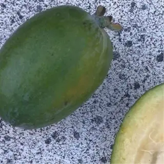 whole and halved pineapple guava fruit